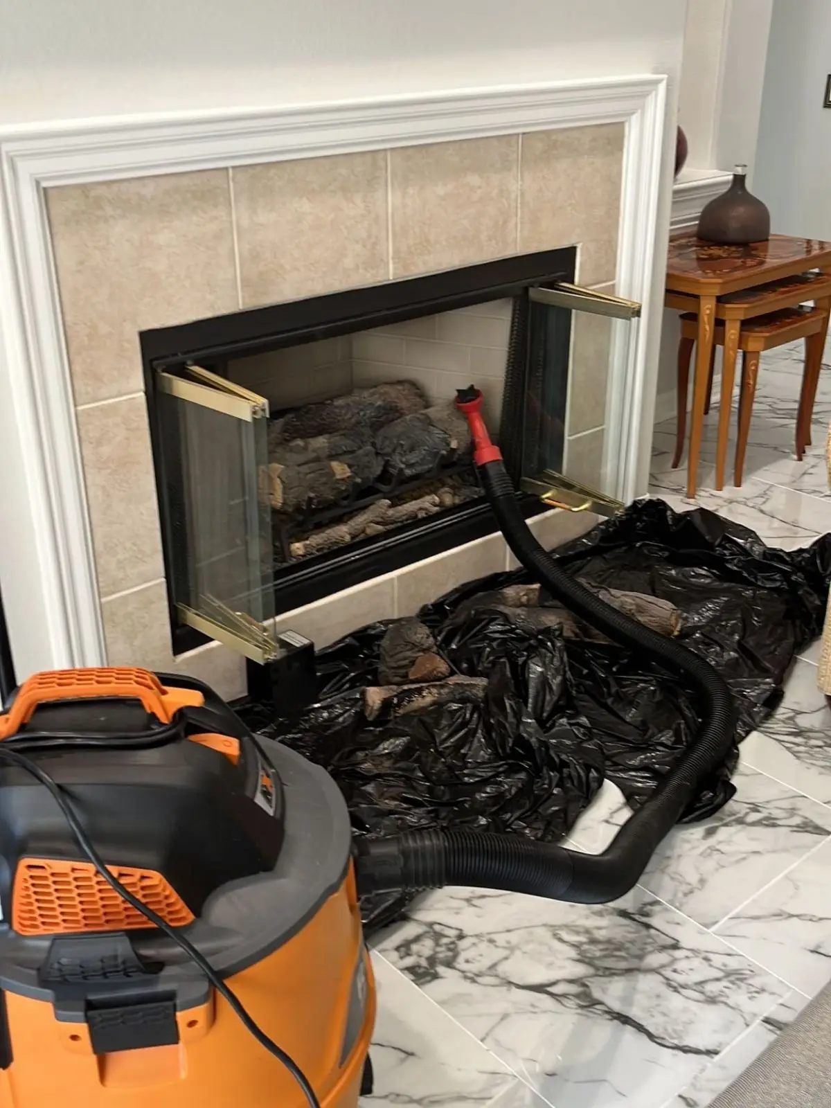 Professional vacuum machine used for fireplace cleaning and soot removal.