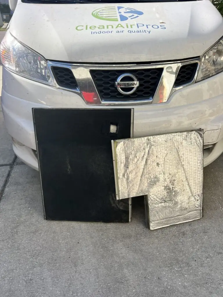 HVAC insulation cleaning before and after results by CleanAirPros. Comparison of a heavily soiled black insulation panel versus a deep-cleaned silver foil panel, showing improved indoor air quality and system hygiene.