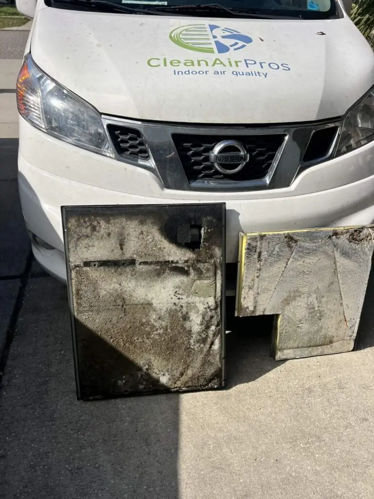 Professional air handler insulation cleaning results by CleanAirPros. Comparison showing a heavily contaminated black insulation panel next to a deep-cleaned silver panel, highlighting improved HVAC hygiene and indoor air quality.