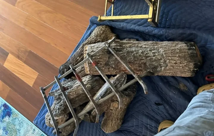 Fireplace logs removed during chimney and fireplace cleaning.