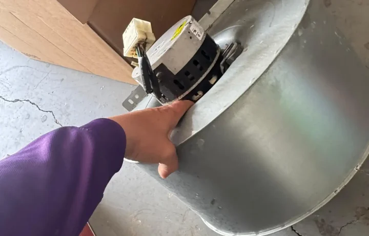 HVAC fan motor being replaced, showcasing the maintenance of crucial HVAC components to ensure system performance and longevity.