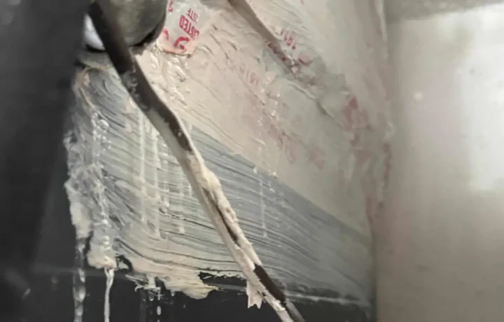 Insulated HVAC pipe with sealant, showing proper sealing techniques to prevent energy loss and improve system efficiency.